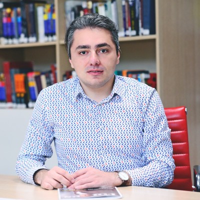 A man sitting at a desk.
